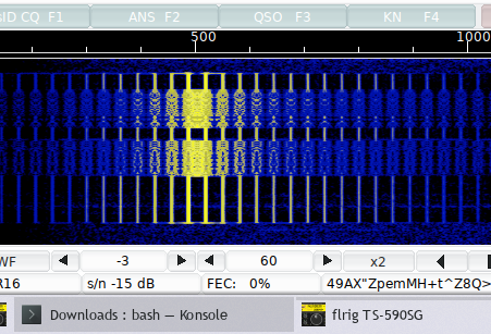 A splattered, overdriven digital signal with dozens of sidebands across the waterfall
